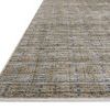 Side angle showing low pile thickness and tightly woven edges of Soho Pebble Charcoal rug