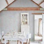 Chelsea wallpaper installed in rustic dining room with wood beams and white vintage furniture