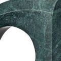 Detailed close-up on marble veining and surface texture focusing on the curved edge with circular void