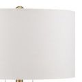 Close-up detail of beige linen lamp shade fabric and brass pull chains