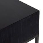 Another close-up angle of top black wood surface showing subtle grain and finish