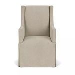 Front view of chair showing symmetrical arms and streamlined upholstery with tailored skirt