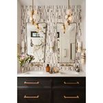 Two Styx Vertical Pendants in brass installed above black vanity with twin mirrors in tiled bathroom
