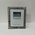 Resin Horn Picture Frame photographed against white textured background in vertical orientation
