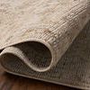Rug edge partially rolled to show thickness and backing weave
