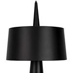 Close-up side view of the black cylindrical lampshade and pointed finial