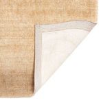 Corner fold showing rug backing and edging detail in beige hue