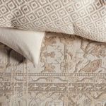 Visible folded edge revealing backside textile and soft pile texture of Valentin Oriental Rug.