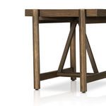 Lower side angle showing triangle wooden braces and leg detail