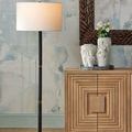 Three vases from Daisy Maria set displayed on wooden cabinet next to black floor lamp