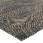 Close-up on micro-tufted texture showing wool fibers and detailed pattern in slate and taupe hues