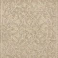 Natural wool area rug with ribbed high-low pile featuring subdued traditional motifs in beige tones