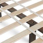 Wood slats and center support beam under mattress showing bed’s durable construction