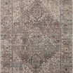Close-up showing the rug’s reversible pile with distinct light and dark sides visible on the same corner