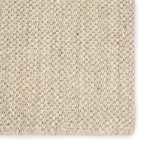 Close-up of sisal weave texture showing neutral taupe and white tones