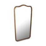 Keyes mirror angled to show scalloped top curve and frame depth with aged brass finish
