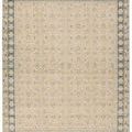 Slightly zoomed out view of rug flat, showing full rectangular shape and floral border in clear focus