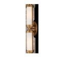 Bowland Bath Wall Sconce in brass with two vertical opaque glass tubes and hourglass-shaped metal caps