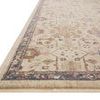 Close-up side profile showing pile texture and navy blue floral border of Giada rug