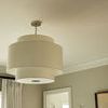 Sawyer pendant hanging in a room near window and mirror with beige wall background