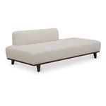 Kenzie Accent Chair shown at a 3/4 angle highlighting its tufted seat and raised wood legs