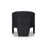 Rear view showing back of chair with rounded wicker barrel shape and central supporting leg