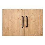 Close-up of Tade cabinet dual black metal handles against natural pine wood