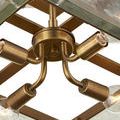View below the fixture emphasizing four gold light sockets extending from the center