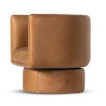 Side view showing rounded back and thick leather upholstery on swivel base