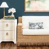 Helena Side Table styled next to a wicker sofa with a lamp, books, and white flower vase on top in a living room