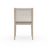 Back view of Sherwood Washed Brown Outdoor Dining Chair showing taut vertical rope in natural light