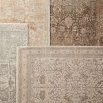 Multiple rugs overlapped with Valentin Oriental Rug in foreground displaying faded botanical print.