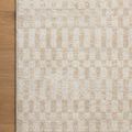 Close crop of Kamala rug corner on wooden floor highlighting pattern detail and color contrast