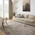 Soho Multi Sand Rug laid in bright living room with beige sofa and modern decor