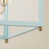 Close-up of bottom edge scalloped trim and brass sphere foot on Soft Arctic Blue Rosalie Lantern