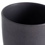 Top interior view looking down into the round opening of the matte black vase