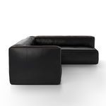 Side angle highlighting black leather texture and contrast stitching on sectional arm