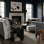 Danville Side Table styled next to a light beige sofa in a dark modern living room