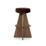 Damon Surrey Plum swivel bar stool with plush round plum-colored upholstered seat, tapered wood base, and metal footrest