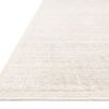 Close-up angled view showing low pile texture and fine woven grid detailing on the rug surface
