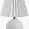 Ferez accent table lamp with round white ceramic base and pleated white linen shade with brass neck