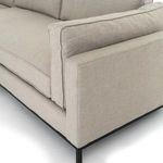 High-angle close-up showing corner of sectional with joined cushions