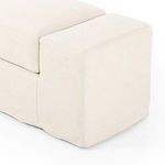 Front view of bench in studio setting with smooth slipcover draping over frame