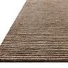 Low angled close-up showing textured pile and layered stripes of wool fibers on edge of Sunday Mocha Ivory Rug