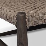 Close-up of wooden tapered leg beneath tightly woven taupe rope tabletop, showing natural wood grain