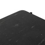 Top view close-up of black marble shelf showing subtle veining and texture variations