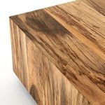 Close-up focus on wood grain and spalting contrast along table’s edge
