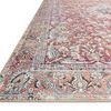 Close-up angled view showing rug's detailed border design and low pile texture