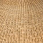 Close-up detail of the fine handwoven rattan pattern on the pendant shade