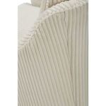 Close-up showing armrest’s vertical rib texture and stuffed piping detail